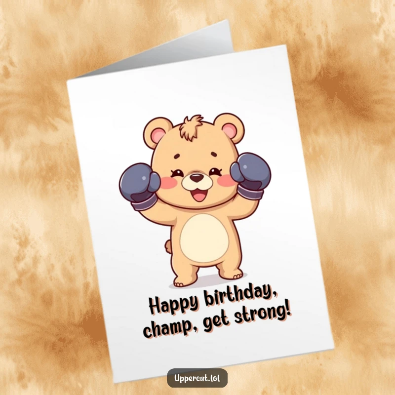 Funny Free Printable birthday card featuring a happy bear cub wearing boxing gloves and throwing a playful jab.